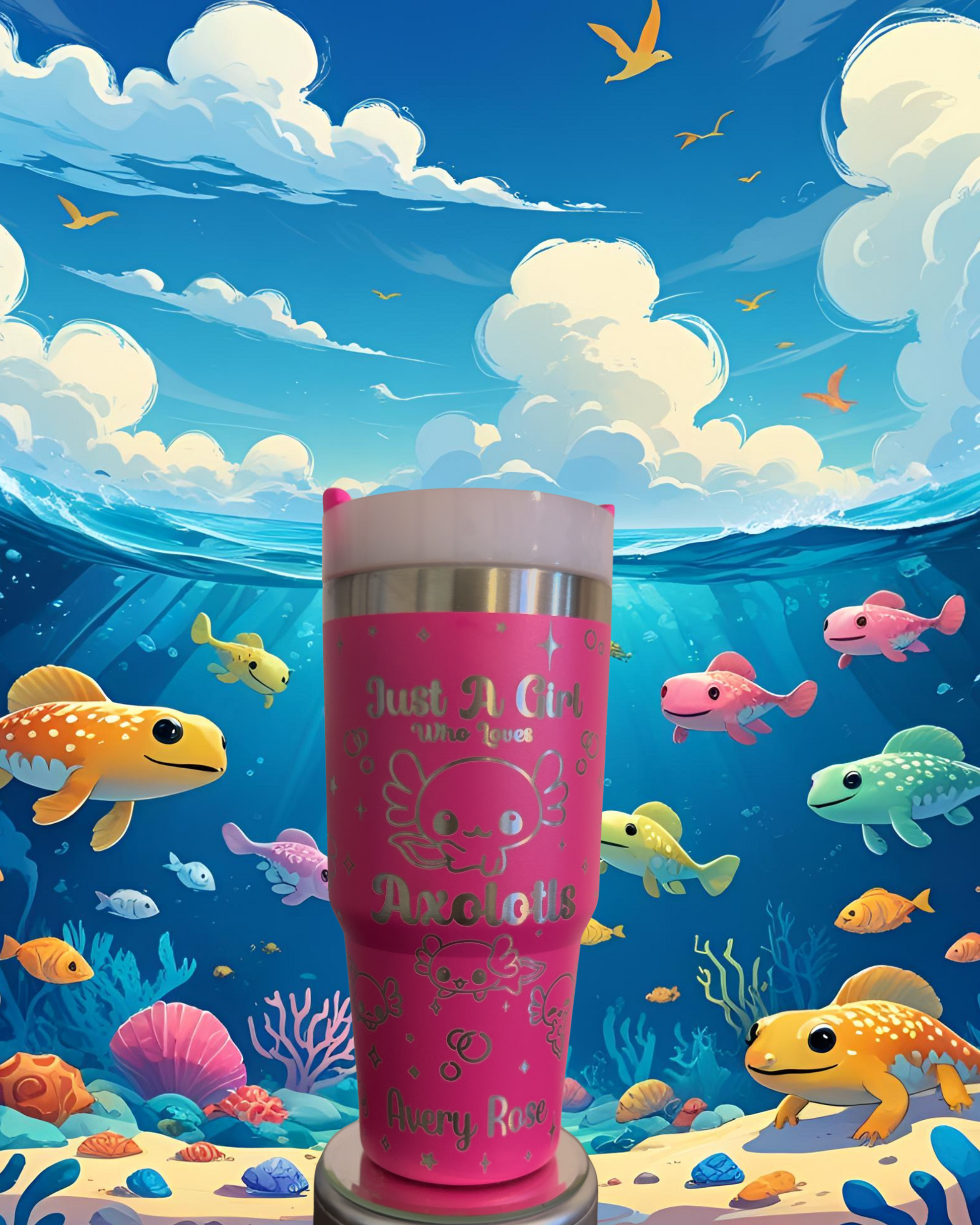 A pink tumbler with a cartoon fish design sits in the foreground, surrounded by a vibrant underwater scene with various colorful fish swimming around.