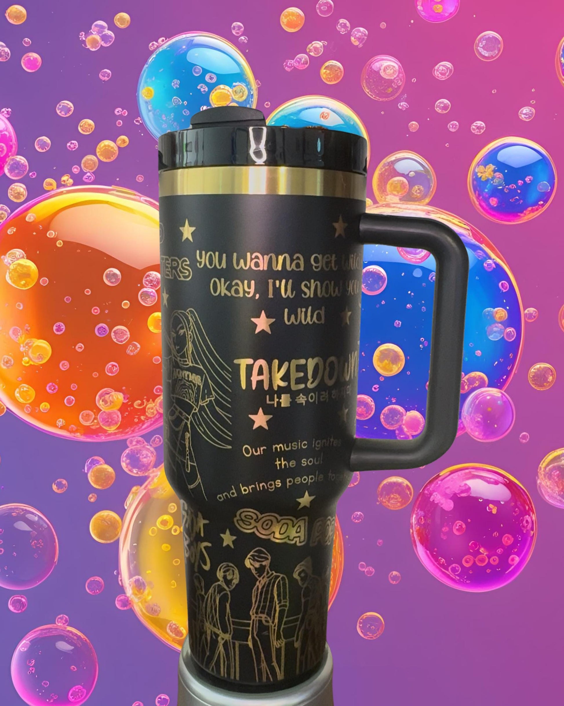 A black and gold insulated tumbler mug with a handle, featuring a design with stars and bubbles, and text that reads &quot;You wanna get me? okay, I&#39;ll show you wild&quot; and &quot;TAKEDOWN&quot; along with some Korean text.